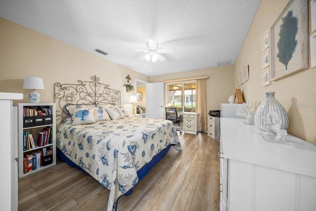 8461 SW 109th St, Ocala, FL 34481 - bedroom featuring light wood-type flooring, a textured ceiling, and ceiling fan