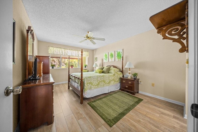 8461 SW 109th St, Ocala, FL 34481 - bedroom featuring a textured ceiling, light wood finished floors, and a ceiling fan