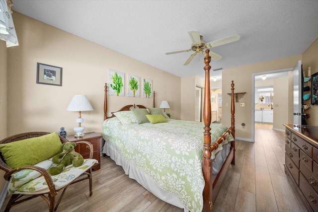 8461 SW 109th St, Ocala, FL 34481 - bedroom with light wood-type flooring, a closet, a textured ceiling, connected bathroom, and a ceiling fan