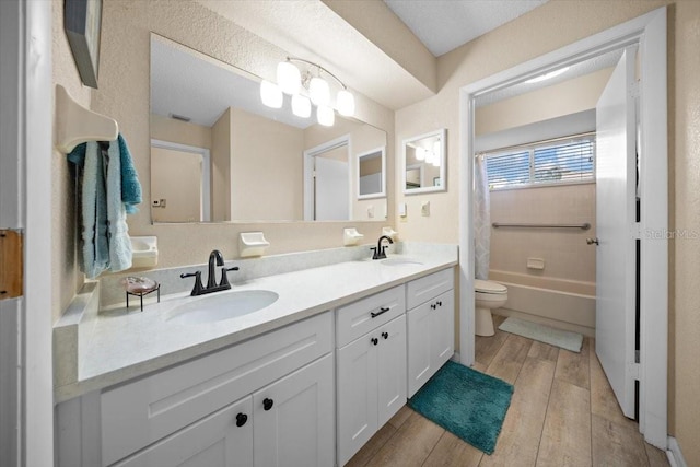 8461 SW 109th St, Ocala, FL 34481 - bathroom with double vanity, wood finished floors, and shower / tub combo