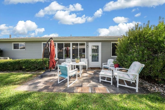 8461 SW 109th St, Ocala, FL 34481 - back of property featuring a patio area and a lawn
