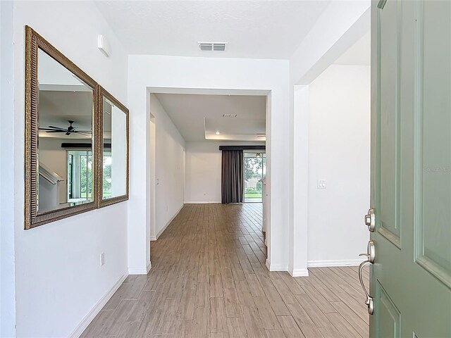 7067 SW 60th Ln, Ocala, FL 34474 - hall featuring baseboards and light wood-style flooring