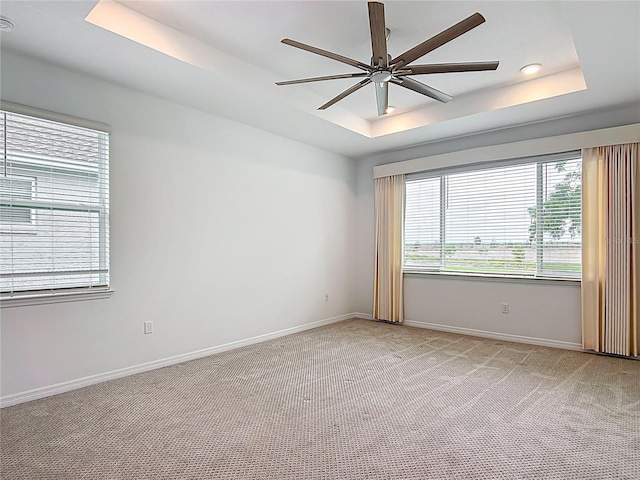7067 SW 60th Ln, Ocala, FL 34474 - unfurnished room with a raised ceiling, ceiling fan, light carpet, plenty of natural light, and recessed lighting