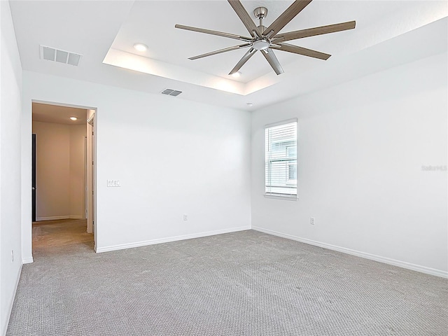 7067 SW 60th Ln, Ocala, FL 34474 - spare room featuring carpet, a raised ceiling, a ceiling fan, and recessed lighting