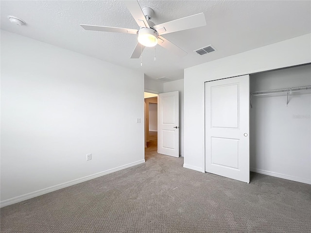 7067 SW 60th Ln, Ocala, FL 34474 - unfurnished bedroom featuring carpet flooring, a closet, and ceiling fan