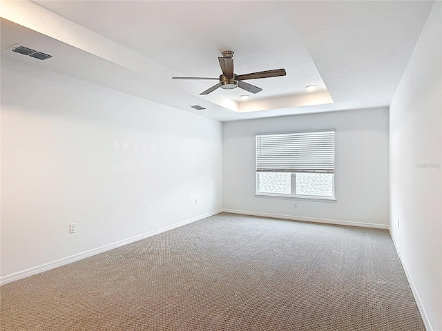 7067 SW 60th Ln, Ocala, FL 34474 - spare room with ceiling fan, carpet flooring, and a raised ceiling