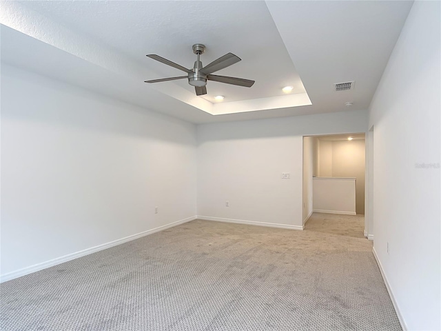 7067 SW 60th Ln, Ocala, FL 34474 - unfurnished room featuring a ceiling fan, light colored carpet, a tray ceiling, and recessed lighting