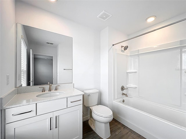 7067 SW 60th Ln, Ocala, FL 34474 - full bath with wood finished floors, vanity, and tub / shower combination