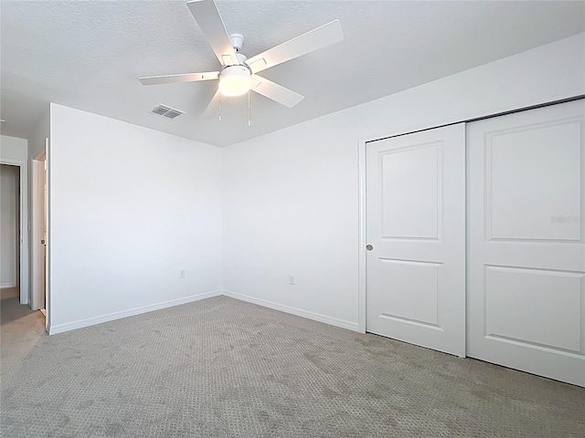 7067 SW 60th Ln, Ocala, FL 34474 - unfurnished bedroom featuring carpet flooring, a closet, and ceiling fan