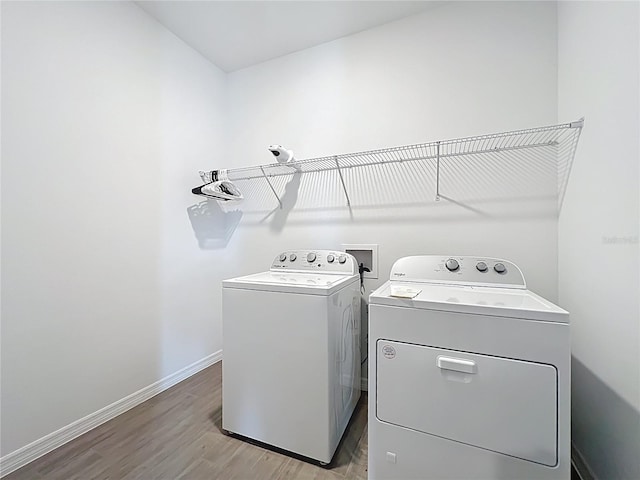 7067 SW 60th Ln, Ocala, FL 34474 - laundry room with separate washer and dryer and light wood-style flooring