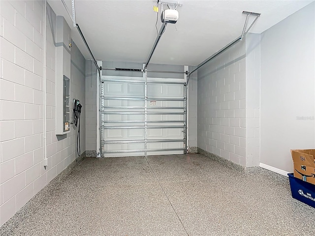 7067 SW 60th Ln, Ocala, FL 34474 - garage featuring concrete block wall and a garage door opener