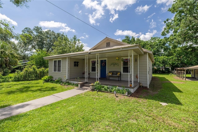 1330 NE 55th St, Ocala, FL 34479 - view of front of property featuring a porch and a front lawn