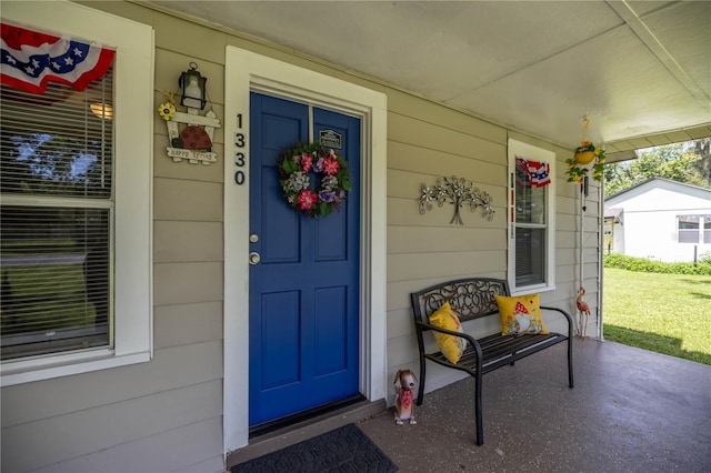 1330 NE 55th St, Ocala, FL 34479 - doorway to property with a porch