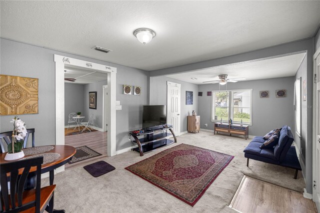 1330 NE 55th St, Ocala, FL 34479 - living room with ceiling fan and carpet flooring