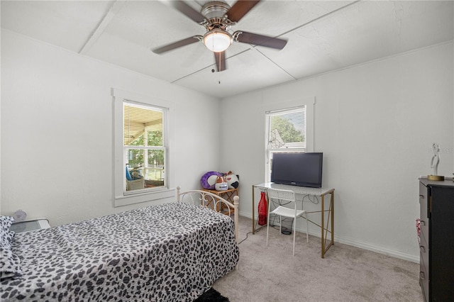 1330 NE 55th St, Ocala, FL 34479 - carpeted bedroom with baseboards and ceiling fan