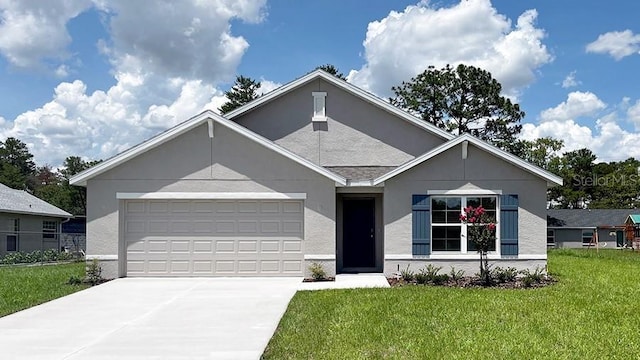 12892 SW 71st Ct, Ocala, FL 34473 - view of front of house featuring an attached garage, a front lawn, driveway, and stucco siding