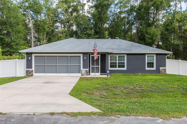 6 Sequoia Loop, Ocklawaha, FL 32179 - single story home with an attached garage, concrete driveway, stone siding, roof with shingles, and view of scattered trees