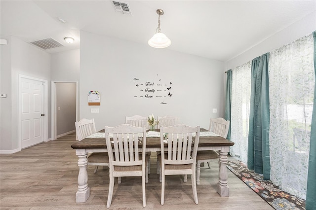6 Sequoia Loop, Ocklawaha, FL 32179 - dining room featuring light wood finished floors and vaulted ceiling