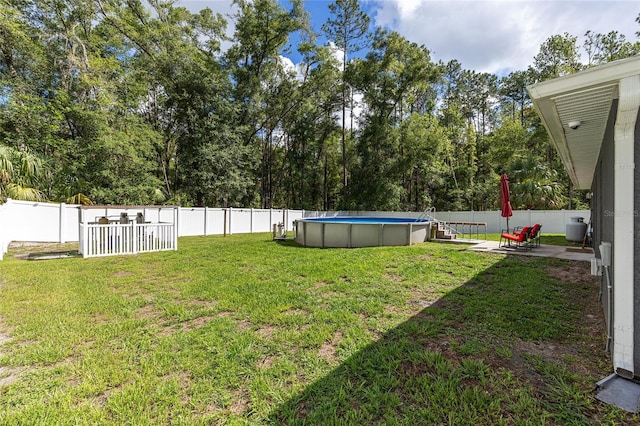 6 Sequoia Loop, Ocklawaha, FL 32179 - fenced backyard with view of scattered trees