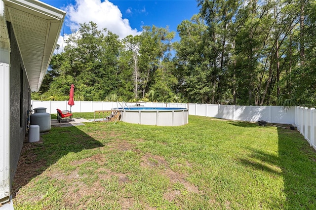 6 Sequoia Loop, Ocklawaha, FL 32179 - fenced backyard featuring view of scattered trees