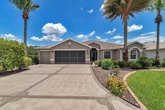 1443 SW 161st St, Ocala, FL 34473 - ranch-style house featuring stucco siding, an attached garage, and driveway