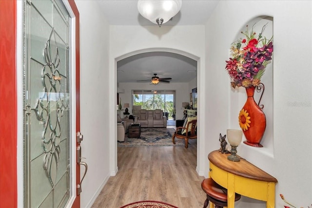 1443 SW 161st St, Ocala, FL 34473 - entryway with arched walkways, light wood-type flooring, and ceiling fan