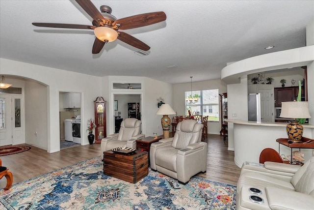 1443 SW 161st St, Ocala, FL 34473 - living area with a ceiling fan, washer / dryer, and wood finished floors