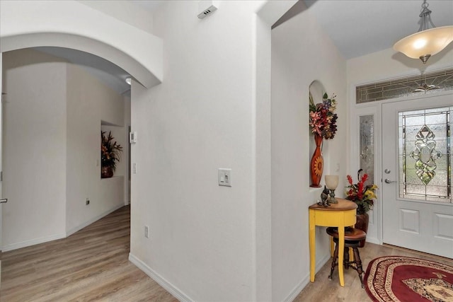 1443 SW 161st St, Ocala, FL 34473 - entrance foyer featuring arched walkways and light wood-style flooring