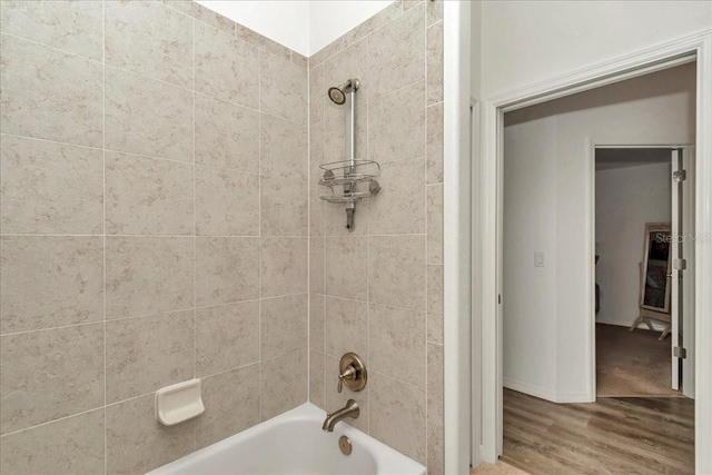 1443 SW 161st St, Ocala, FL 34473 - bathroom featuring tub / shower combination and wood finished floors