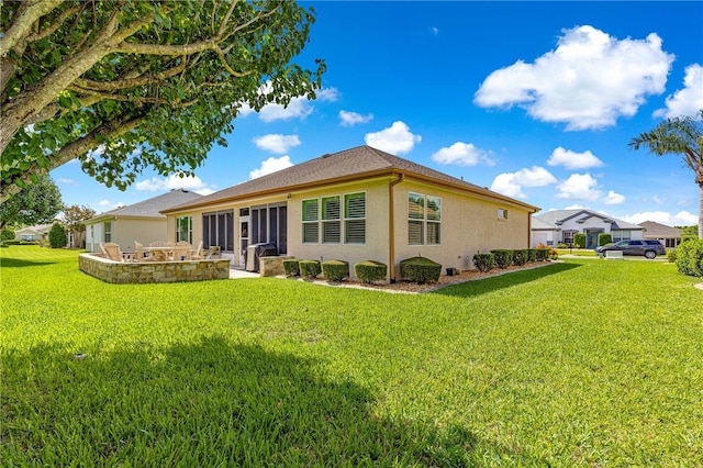 9120 SE 125th Loop, Summerfield, FL 34491 - back of property featuring stucco siding, a lawn, and a patio