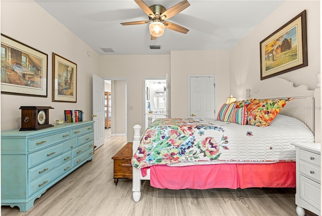 9120 SE 125th Loop, Summerfield, FL 34491 - bedroom with light wood-style flooring and ceiling fan