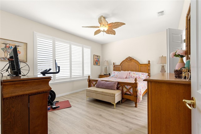 9120 SE 125th Loop, Summerfield, FL 34491 - bedroom with light wood-style flooring and a ceiling fan