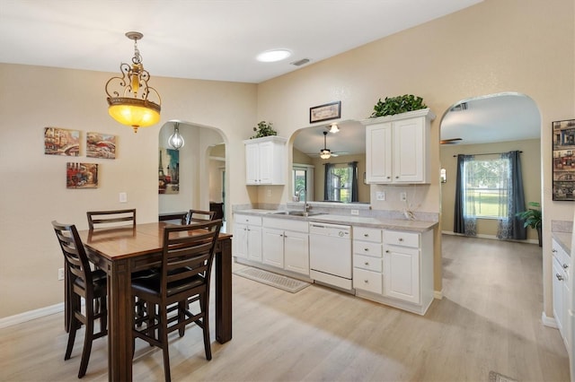 12178 SE 174th Pl, Summerfield, FL 34491 - dining area featuring arched walkways and light wood-type flooring