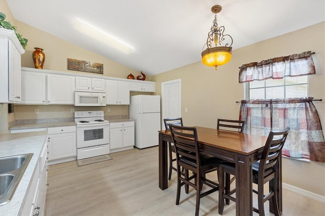 12178 SE 174th Pl, Summerfield, FL 34491 - dining space featuring vaulted ceiling and light wood finished floors