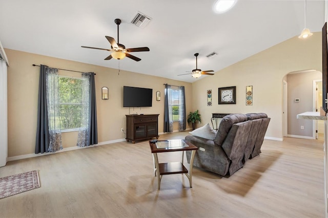 12178 SE 174th Pl, Summerfield, FL 34491 - living area with arched walkways, a ceiling fan, light wood-type flooring, and vaulted ceiling