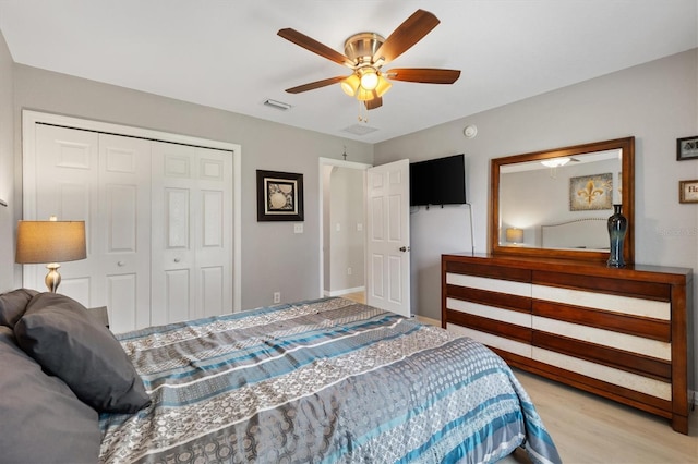 12178 SE 174th Pl, Summerfield, FL 34491 - bedroom with a closet, wood finished floors, and ceiling fan