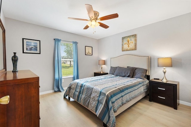 12178 SE 174th Pl, Summerfield, FL 34491 - bedroom with light wood-style floors and ceiling fan