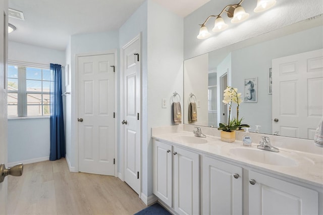 12178 SE 174th Pl, Summerfield, FL 34491 - full bathroom featuring wood finished floors and double vanity