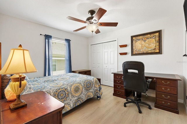 12178 SE 174th Pl, Summerfield, FL 34491 - bedroom with light wood-type flooring, a closet, ceiling fan, and a desk