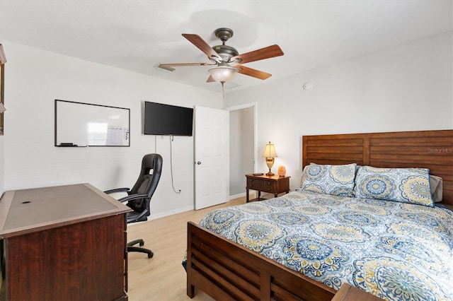 12178 SE 174th Pl, Summerfield, FL 34491 - bedroom with a desk, light wood finished floors, and a ceiling fan