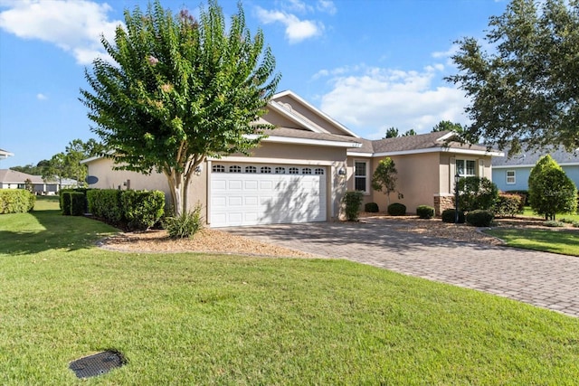 9926 SW 95th Loop, Ocala, FL 34481 - single story home with an attached garage, stucco siding, decorative driveway, and a front lawn