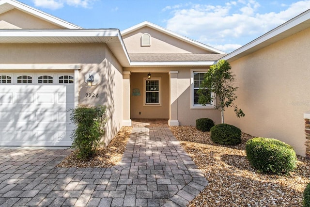 9926 SW 95th Loop, Ocala, FL 34481 - entrance to property featuring stucco siding and a garage