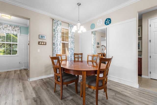 9926 SW 95th Loop, Ocala, FL 34481 - dining room with a chandelier, light wood-style floors, and ornamental molding