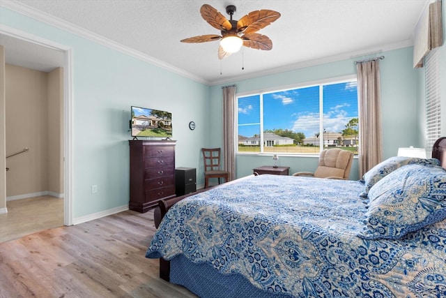9926 SW 95th Loop, Ocala, FL 34481 - bedroom featuring wood finished floors, crown molding, and a ceiling fan