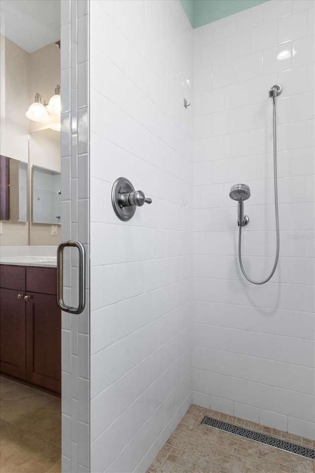 9926 SW 95th Loop, Ocala, FL 34481 - bathroom featuring a stall shower, vanity, and tile patterned flooring
