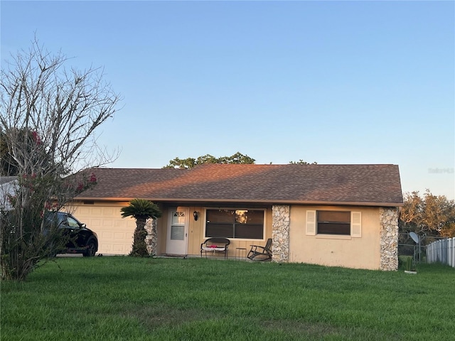 10885 SE 74th Ct, Belleview, FL 34420 - view of front of home with an attached garage, stone siding, and roof with shingles