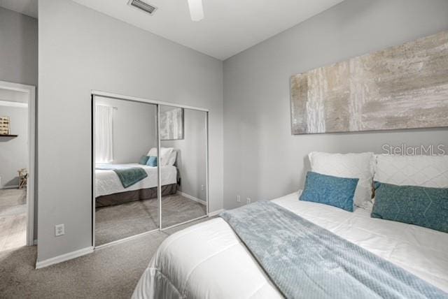 2418 SE 22nd Pl, Ocala, FL 34471 - carpeted bedroom with a closet and a ceiling fan