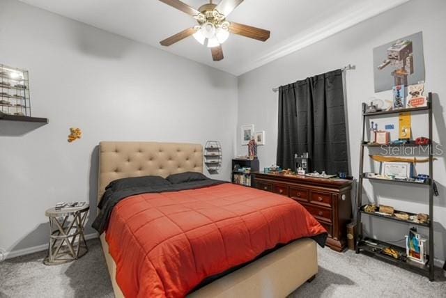 2418 SE 22nd Pl, Ocala, FL 34471 - bedroom featuring carpet floors and a ceiling fan