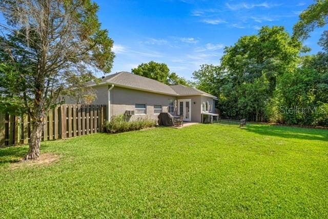 2418 SE 22nd Pl, Ocala, FL 34471 - rear view of property with stucco siding