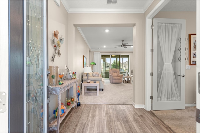 10597 SW 90th Street Rd, Ocala, FL 34481 - entryway with ornamental molding, wood finished floors, a ceiling fan, carpet flooring, and recessed lighting